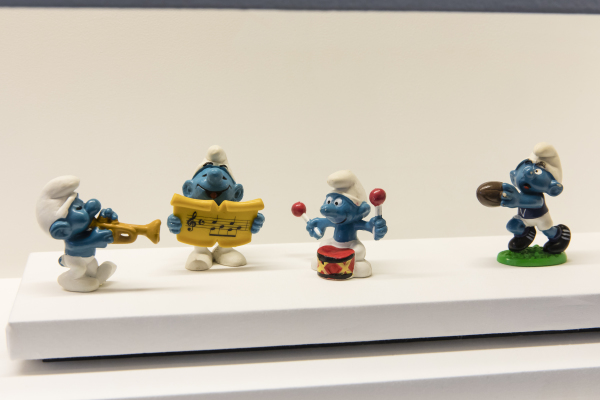 Photograph of Four Smurf figurines on display
